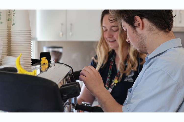 Students and staff working in the Grossmann Café.